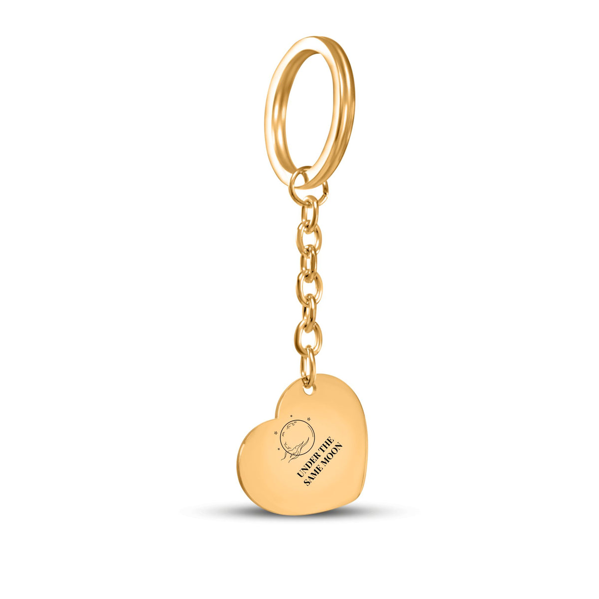 Gold heart keychain engraved with a full moon and UNDER THE SAME MOON on white