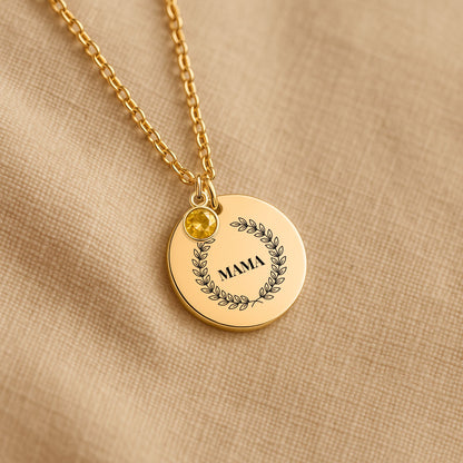 Laurel wreath MAMA coin necklace with a birthstone charm on linen