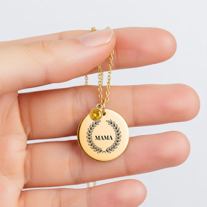 Mama laurel coin necklace with birthstone charm held between fingers