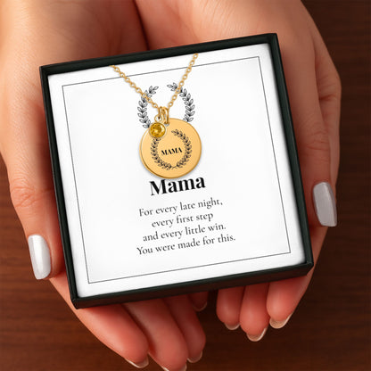 Hands holding the Mama birthstone necklace gift box