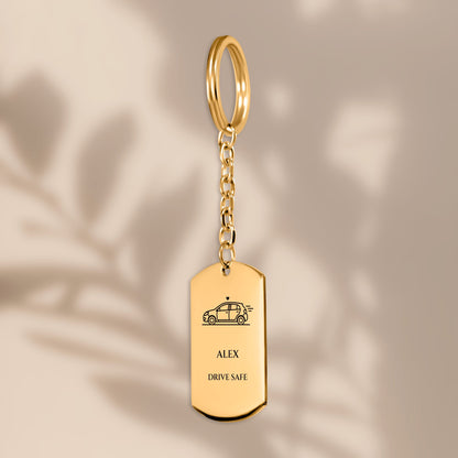 Personalized DRIVE SAFE car keychain in soft window light