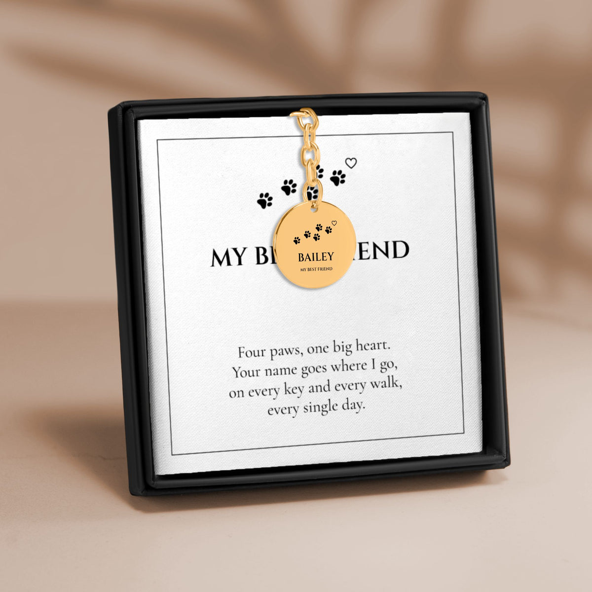 Personalized pet name paw print coin keychain in gold on a MY BEST FRIEND card in a gift box