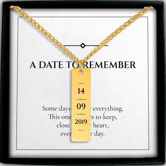 Personalized date vertical bar necklace in gold on an A DATE TO REMEMBER card in a gift box