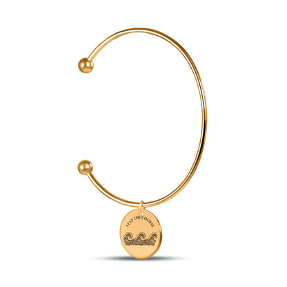 Open bangle bracelet with a 20mm coin charm engraved with ocean waves and STAY THE COURSE