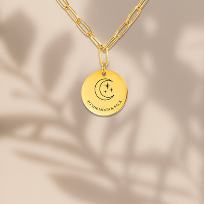 Paperclip chain crescent moon coin necklace with soft shadows