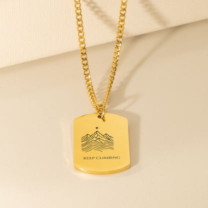 Engraved mountain ridge dog tag necklace on a Cuban curb chain, 18k gold plated