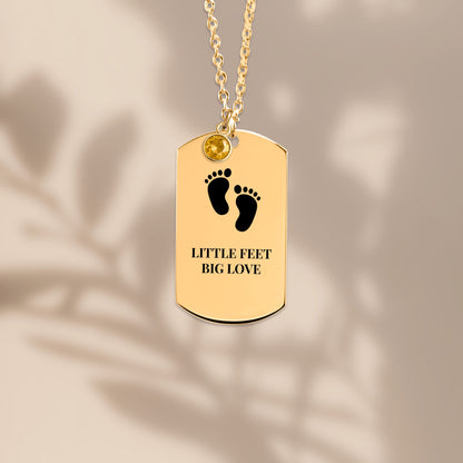 Baby footprints tag pendant with soft leaf shadows