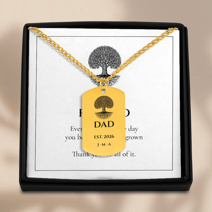 Dad Est. Year dog tag necklace in an open gift box with its message card