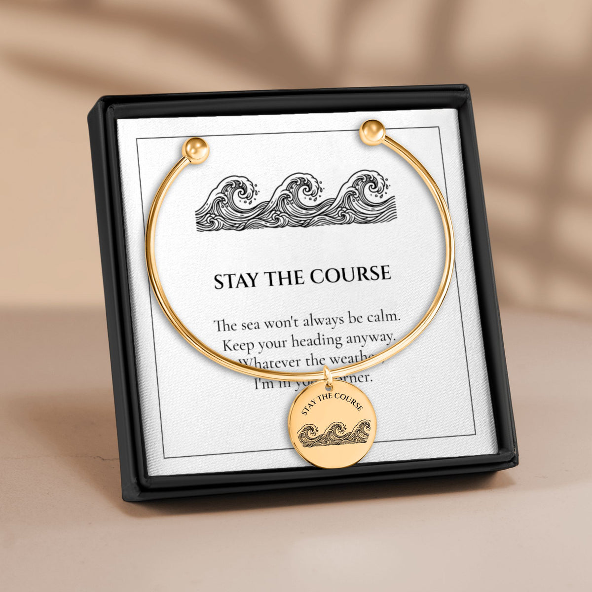 Stay the Course ocean wave coin charm bangle in its gift box with the matching message card