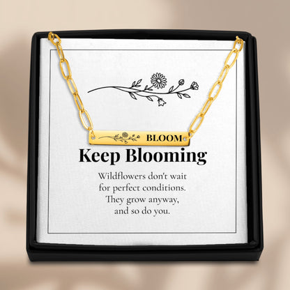Bloom necklace on its Keep Blooming card in a black gift box