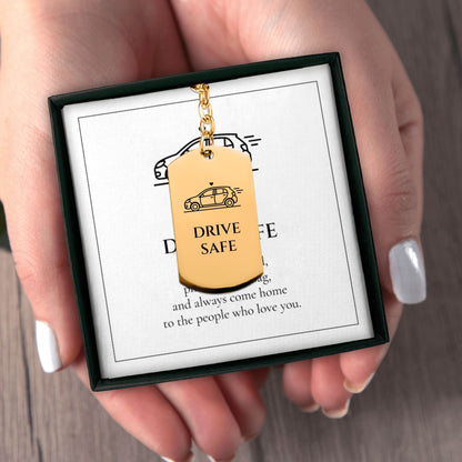 Hands holding the Drive Safe keychain gift box