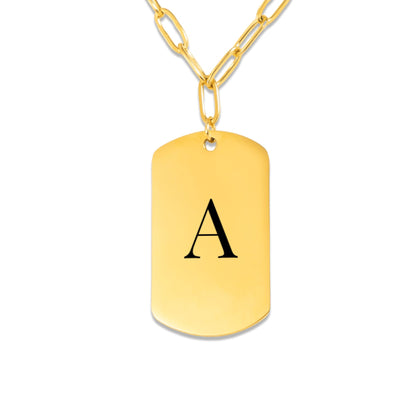 Initial tag necklace on white showing the engraved letter