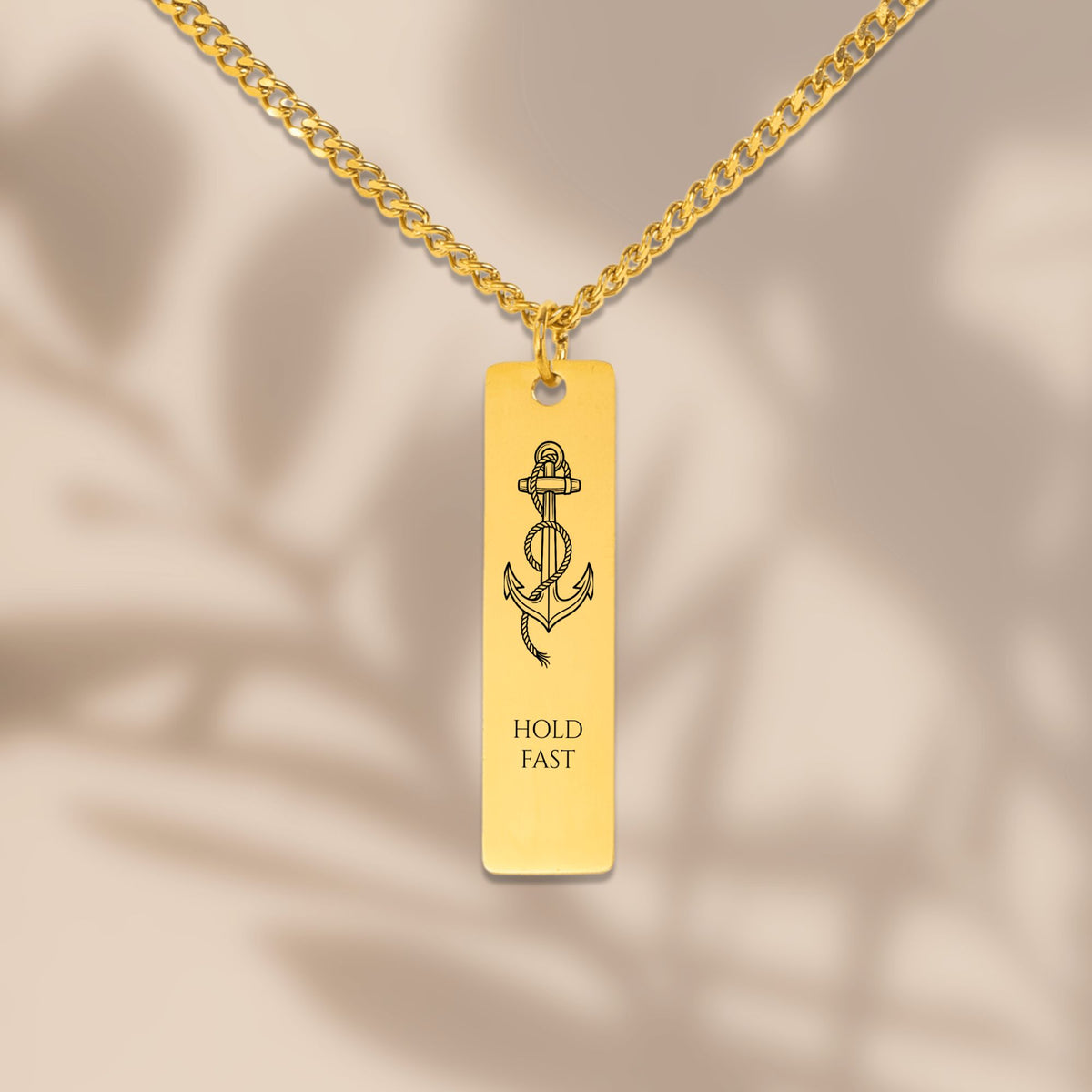 Close-up of the laser engraved anchor bar on a Cuban chain