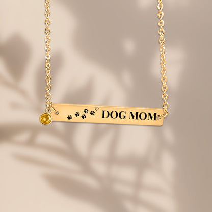 Paw print DOG MOM bar pendant with soft leaf shadows