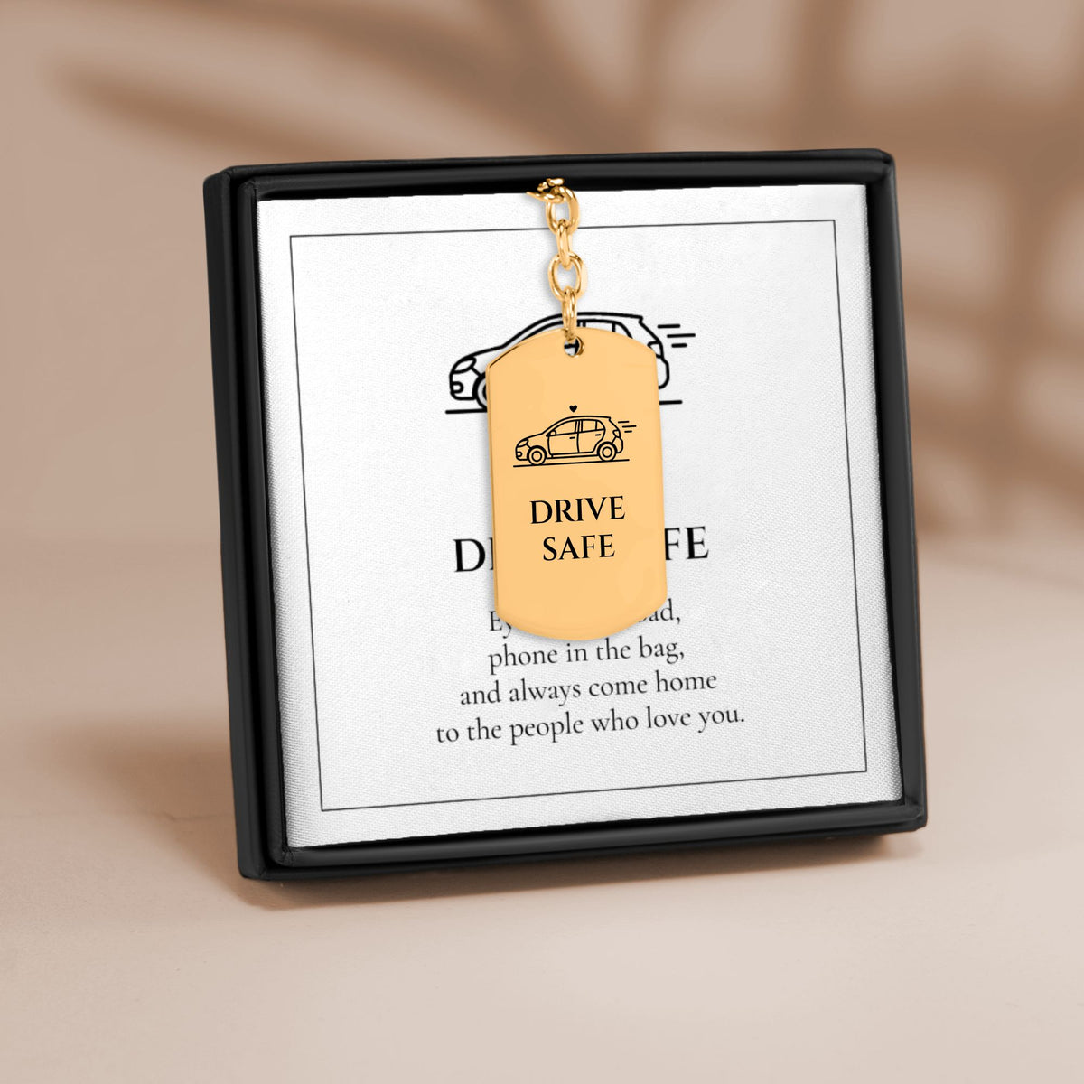 Drive Safe car tag keychain on its Drive Safe message card in a gift box