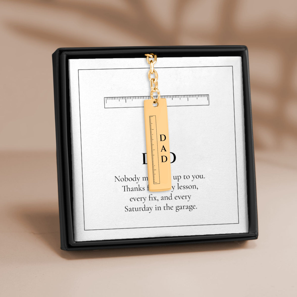 Dad ruler vertical bar keychain on its DAD message card in a gift box