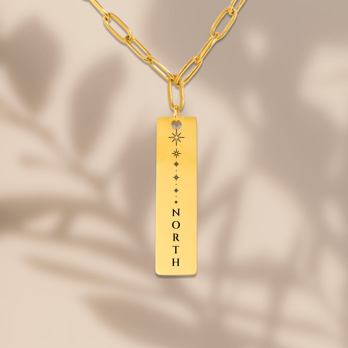 North Star vertical bar pendant with soft leaf shadows