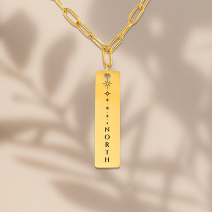 North Star vertical bar pendant with soft leaf shadows