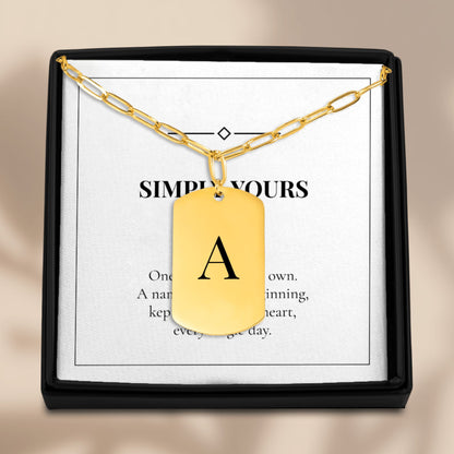 Initial tag necklace in an open gift box with its message card
