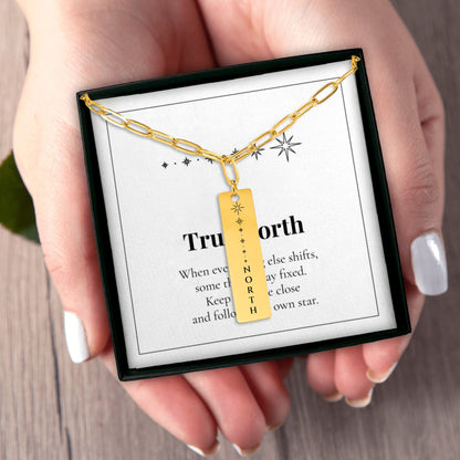 Hands holding the North Star necklace gift box