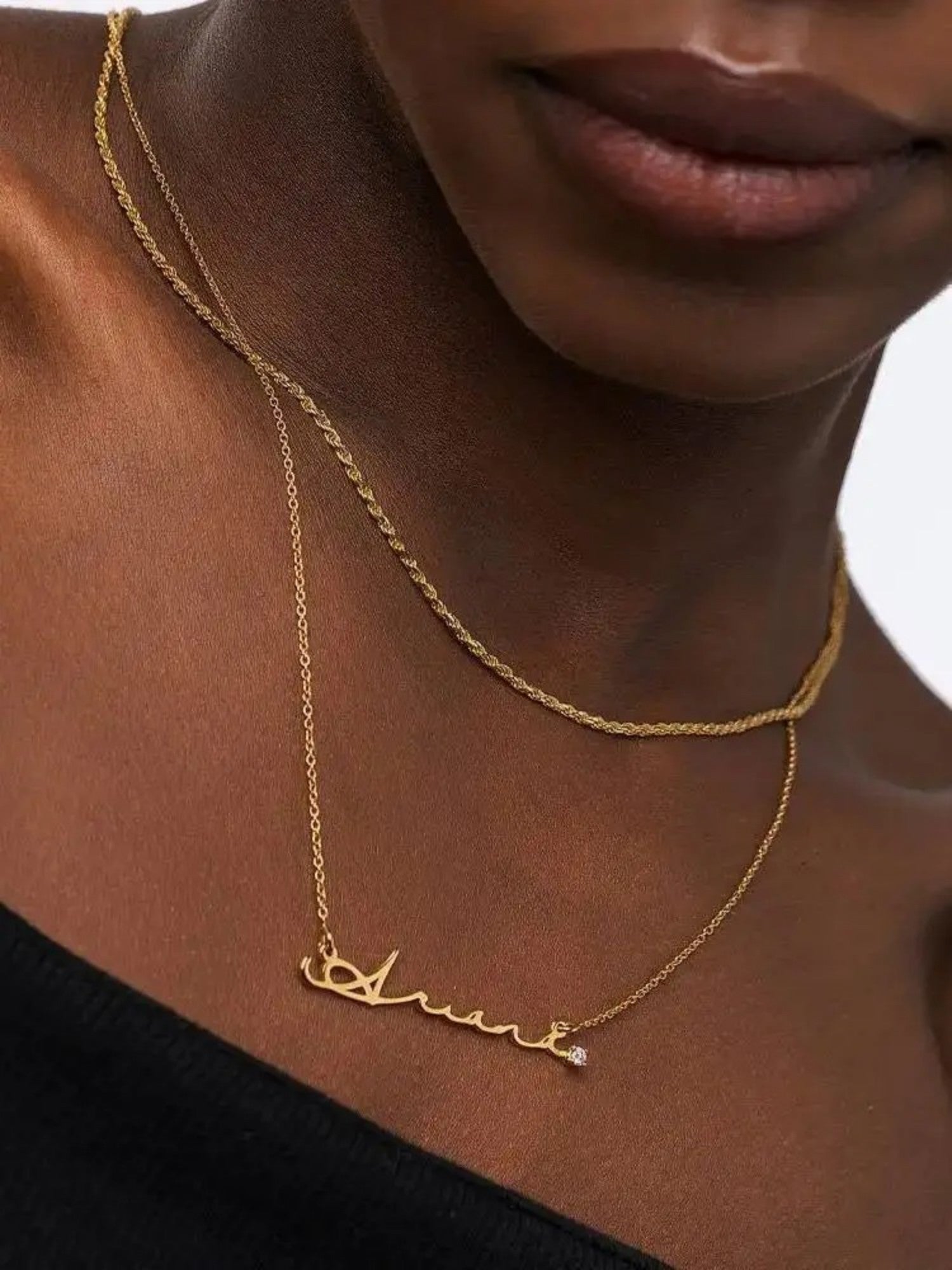 Name necklace shown worn