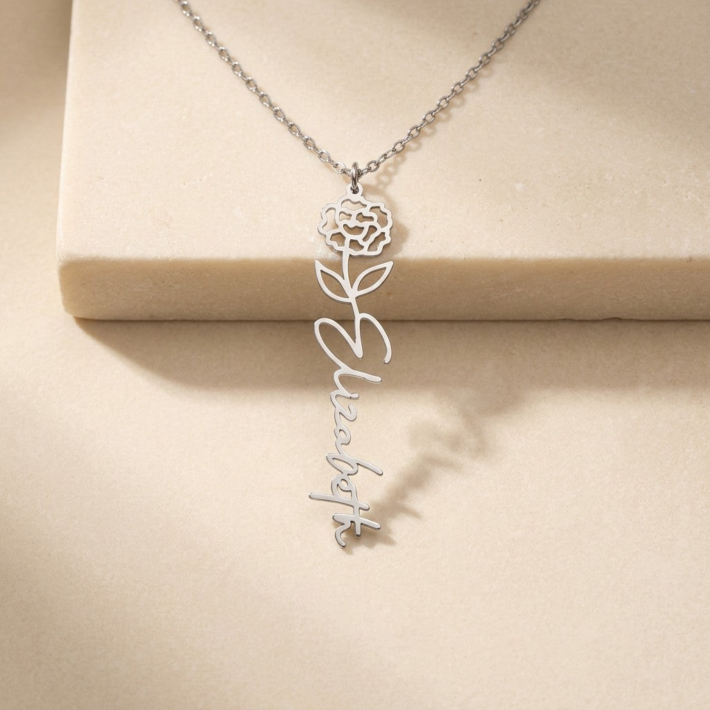 Birth flower vertical name necklace on cream travertine | Flower Name Necklace
