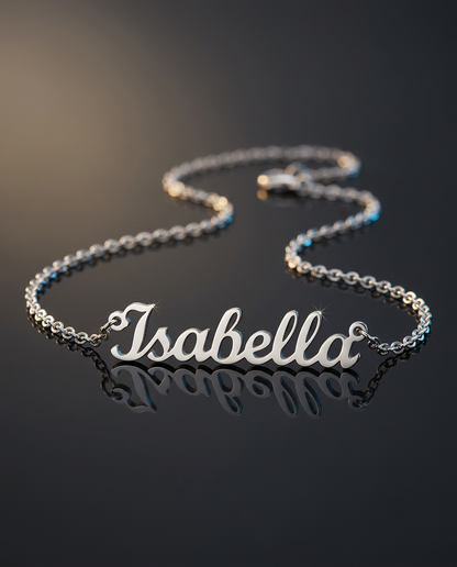 Steel name necklace reading Isabella on a dark reflective surface | Custom Name Necklace