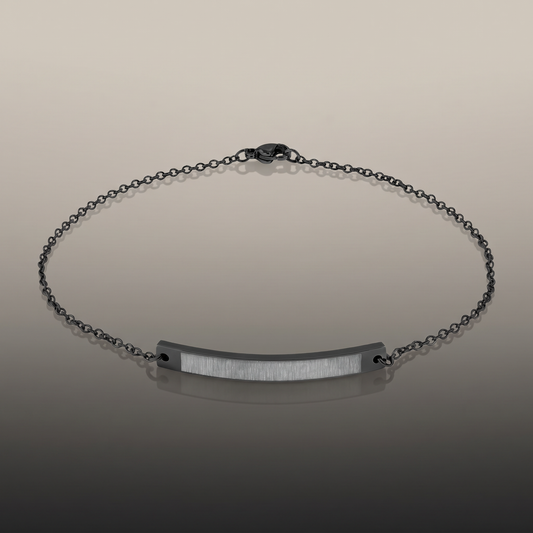 Engraved Curved Bar Anklet on premium studio backdrop, high-contrast catalog shot