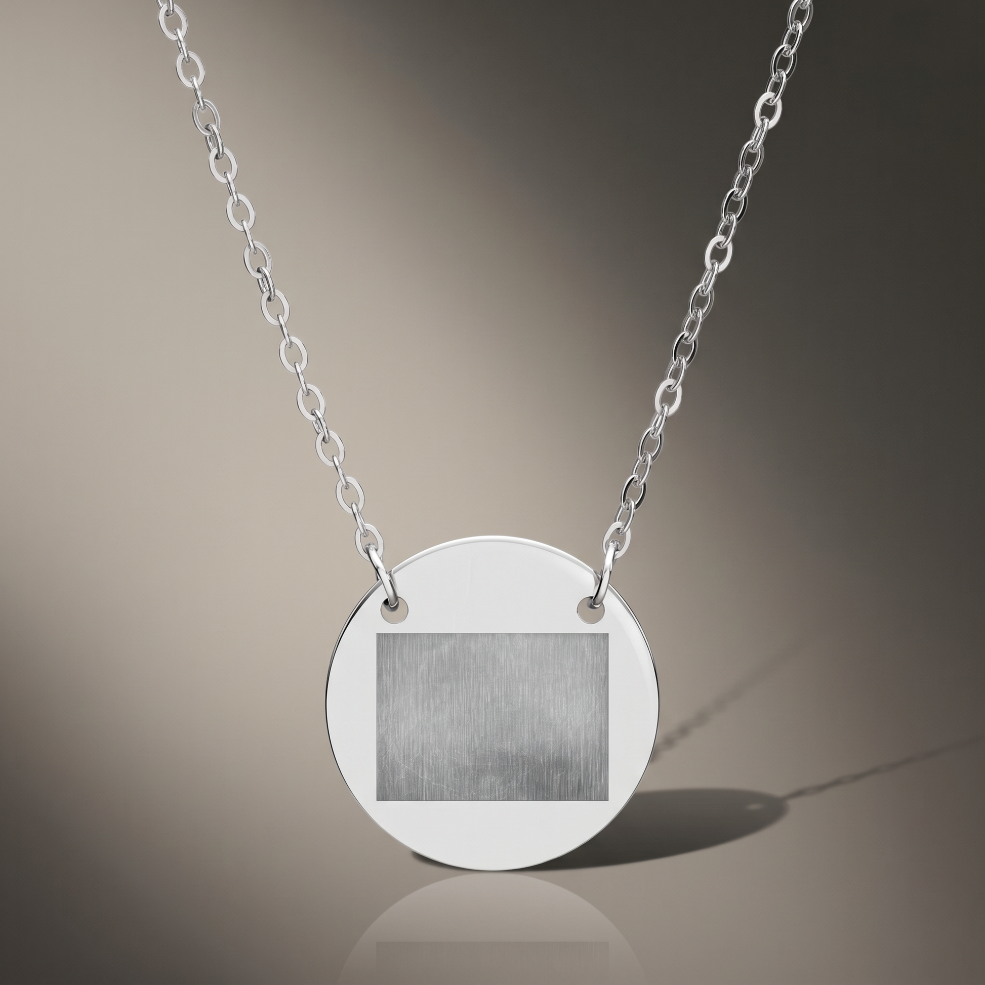 Engraved Circle Necklace on premium studio backdrop, high-contrast catalog shot
