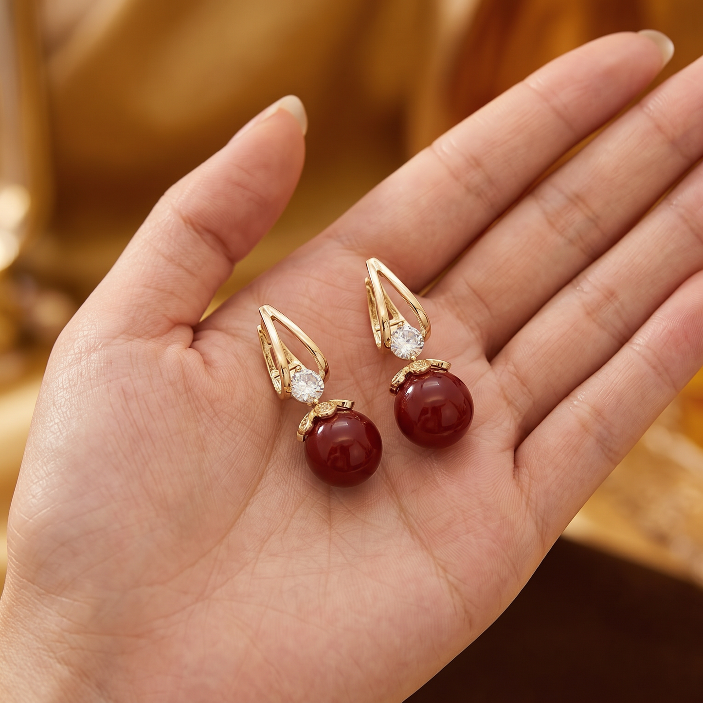 Crystal & Pearl Drop Earrings — in palm for scale