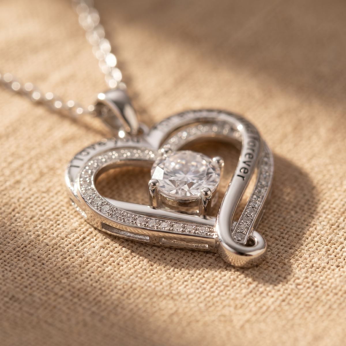 Close view of the crystal set inside the ribbon heart pendant | Love You Always Necklace